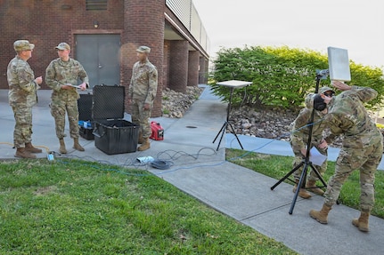 U.S. Air Force Airmen from the I.G. Brown Training and Education Center, Cyber Operations, and 134th Air Refueling Wing, Communications Squadron, prepare a Starlink satellite system to test connectivity, April 9, 2026, McGhee Tyson Air National Guard Base, Tennessee.