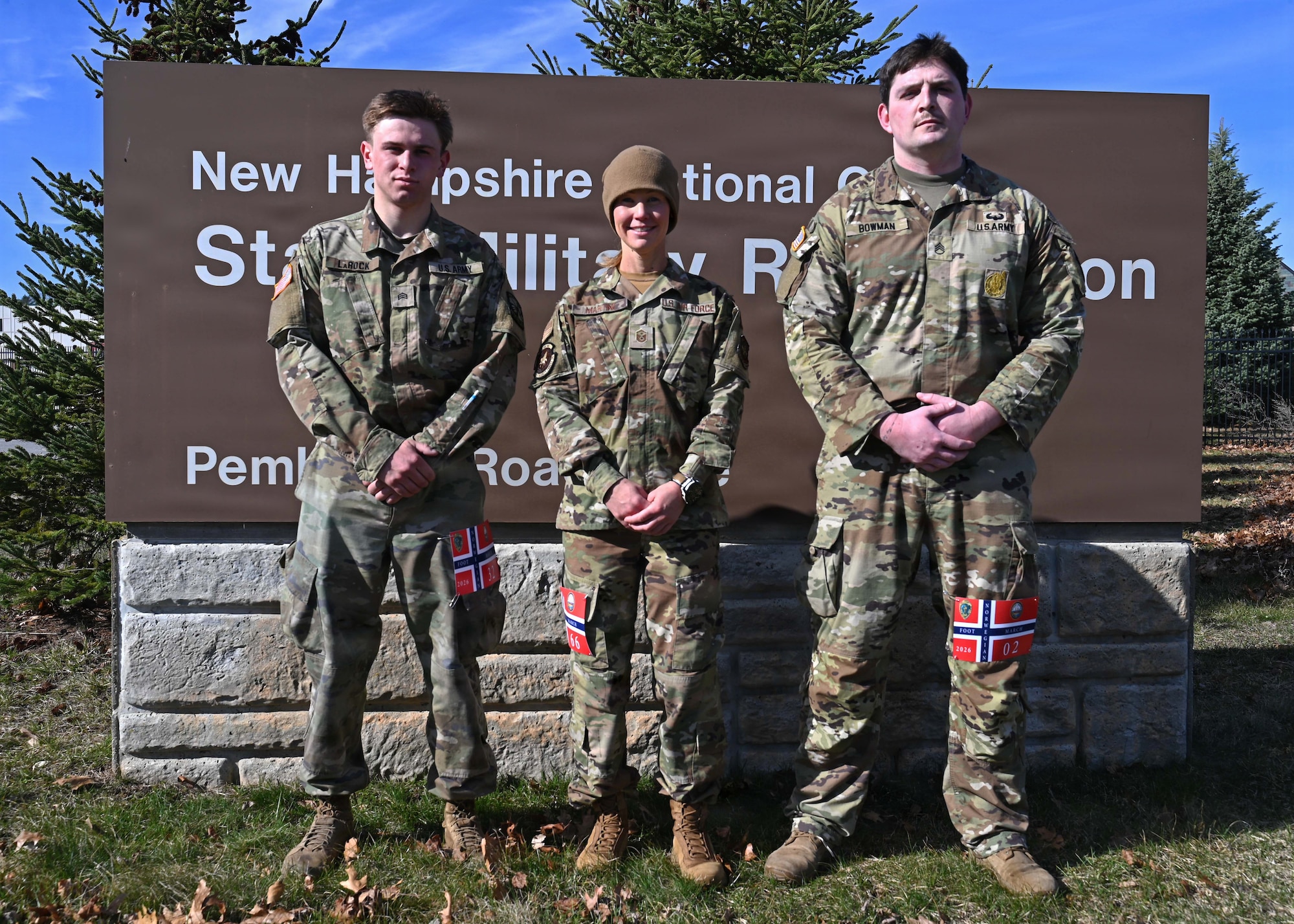 From left, Cadet Quinn LaRock of University of New Hampshire’s Army ROTC program; Master Sgt. Amber Martine, 157th Security Forces Squadron; New Hampshire Air National Guard; and Staff Sgt. Timothy Bowman, recruiter with New England Recruiting Battalion; assemble after completing a Norwegian Foot March on April 12, 2026, at the state military reservation in Concord, New Hampshire.