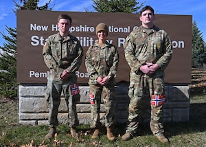 From left, Cadet Quinn LaRock of University of New Hampshire’s Army ROTC program; Master Sgt. Amber Martine, 157th Security Forces Squadron; New Hampshire Air National Guard; and Staff Sgt. Timothy Bowman, recruiter with New England Recruiting Battalion; assemble after completing a Norwegian Foot March on April 12, 2026, at the state military reservation in Concord, New Hampshire.