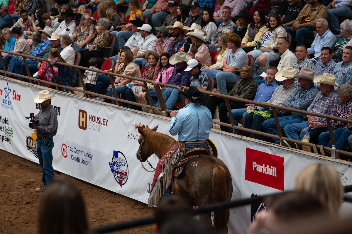 U.S. Air Force Maj. Gen. Roy W. Collins, Air Education Training Command deputy commander, Col. Matthew Norton, 17th Training Wing commander, and San Angelo honorary commanders attend the annual San Angelo Stock Show & Rodeo at the CRC Roofers Coliseum, Texas, April 9, 2026. The San Angelo Stock Show & Rodeo Association hosts this event annually, highlighting the strong community partnership with Goodfellow Air Force Base and its Airmen. (U.S. Air Force photo by Airman 1st Class Maria Mota)