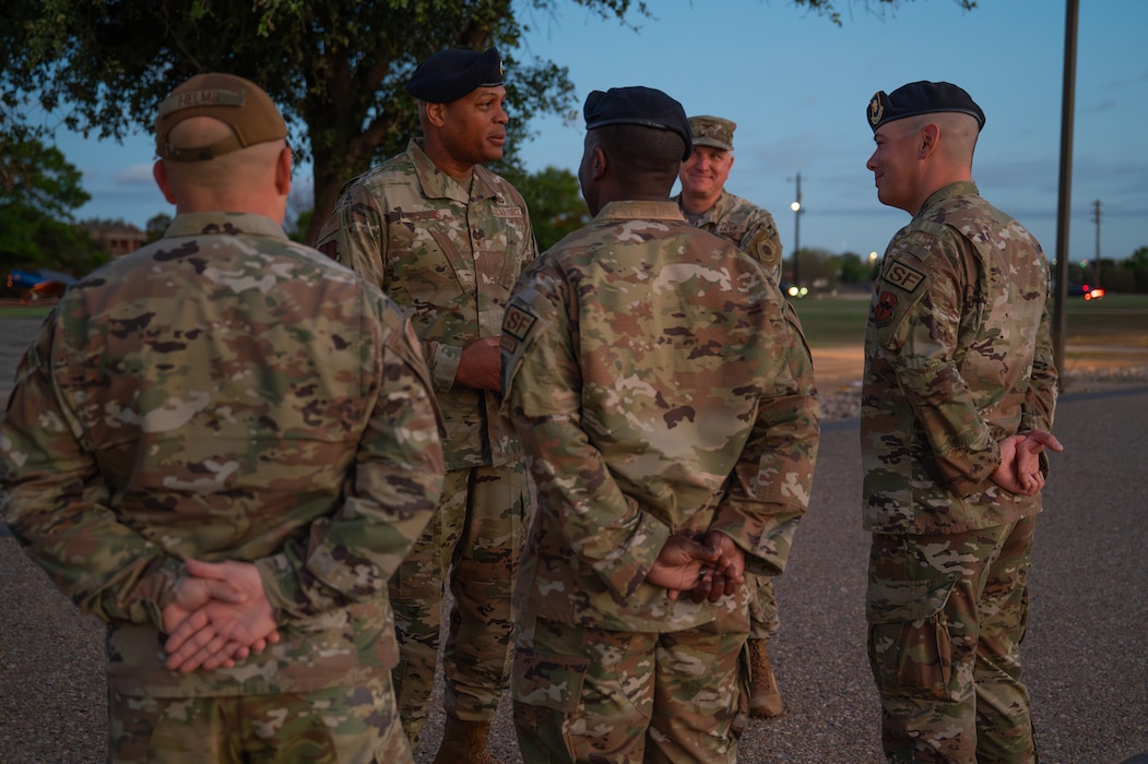 U.S. Air Force Maj. Gen. Roy W. Collins, Air Education Training Command deputy commander, meets with 17th Security Forces Squadron leadership outside the Western Winds Dining Facility at Goodfellow Air Force Base, Texas, April 10, 2026. Collins started his tour with a Defenders’ Breakfast to connect with the members of his first career field. (U.S. Air Force photo by Senior Airman Brian Lummus)