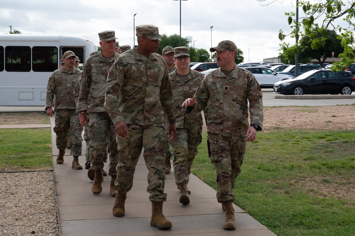 U.S. Air Force Lt. Col. Richard Ball, 315th Training Squadron commander, briefs Maj. Gen. Roy W. Collins, Air Education Training Command deputy commander, on the capabilities of the 315th TRS outside the Intelligence, Surveillance and Reconnaissance Training Campus at Goodfellow Air Force Base, Texas, April 10, 2026. The 17th Training Group trains joint service members and allies in intelligence gathering and analysis, preparing them to serve anywhere, anytime. (U.S. Air Force photo by Senior Airman Brian Lummus)