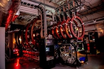 The Space Physics Simulation chamber. A large vacuum chamber that can recreate plasma conditions in space to study basic plasma physics phenomena and test hardware operation in a simulated environment before flight.  (U.S. Navy photo)