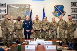 Col. Justin Secrest, 377th Air Base Wing and installation commander, Chief Master Sgt. Andrew Rapsavage, 377th Air Base Wing command chief, Lt. Col. Daniel Peterson, 377th Security Forces Squadron commander, and Senior Master Sgt. Gavin Saiz, 377th Security Forces Squadron senior enlisted leader pose for a group photo with Master Sgt. Chase Eyre, Tech. Sgt. Roman Duran, Staff Sgt. Christian Roybal, Senior Airman Seth Fenton, and Airman 1st Class Samuel Morrison at Kirtland Air Force Base, New Mexico, April 14. The Airmen were coined for their swift response to a bomb threat that occurred March 22 at the Eubank Gate, where their swift actions and professionalism ensured the safety and security of the installation. (U.S. Air Force photo by Senior Airman Donnell Schroeter)