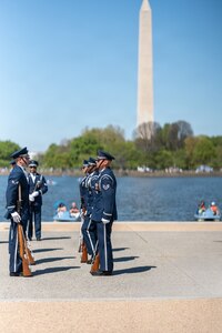Members of the U.S. Air Force Honor Guard Drill Team conduct a drill movement during the Joint Service Drill Exhibition at the Jefferson Memorial, Washington, D.C., April 11, 2026. Military drill teams from all U.S. military services performed while being evaluated on factors such as military bearing, precision, and crowd interaction. The U.S. Air Force Honor Guard Drill Team won the annual exhibition for the first time in 14 years. (U.S. Air Force courtesy photo)