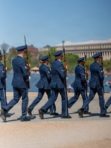 Members of the U.S. Air Force Honor Guard Drill Team march in formation during the Joint Service Drill Exhibition at the Jefferson Memorial, Washington, D.C., April 11, 2026. Military drill teams from all U.S. military services performed while being evaluated on factors such as military bearing, precision, and crowd interaction. The U.S. Air Force Honor Guard Drill Team won the annual exhibition for the first time in 14 years. (U.S. Air Force courtesy photo)