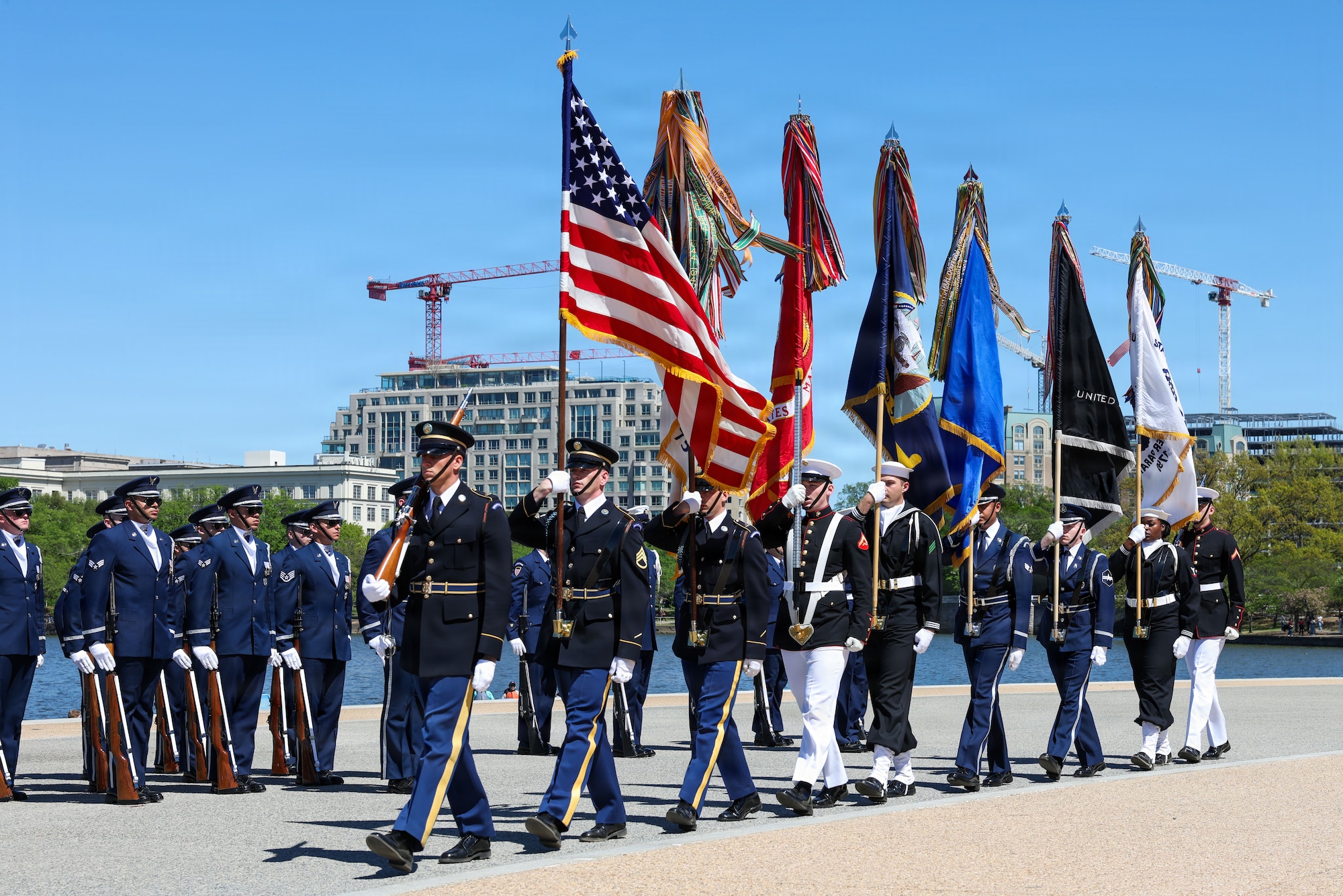 U.S. service members with their respective honor guards execute "march on" prior to the Joint Service Drill Exhibition at the Jefferson Memorial, Washington, D.C., April 11, 2026. Military drill teams from all U.S. military services performed while being evaluated on factors such as military bearing, precision, and crowd interaction. The U.S. Air Force Honor Guard Drill Team won the annual exhibition for the first time in 14 years. (U.S. Marine Corps photo by Cpl. Christopher Prelle)