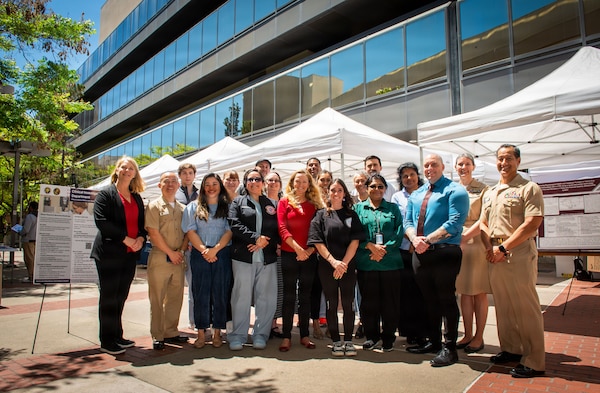 Members of the Clinical Investigation Department at Naval Medical Center San Diego pose for a group photo during the 41st Academic Research Competition and Innovation Day at NMCSD, April 10. NMCSD employs more than 5,500 active-duty military personnel, civilians, and contractors in Southern California to deliver exceptional care afloat and ashore. (U.S. Navy photo by Mass Communication Specialist 1st Class Marcus L. Stanley)
