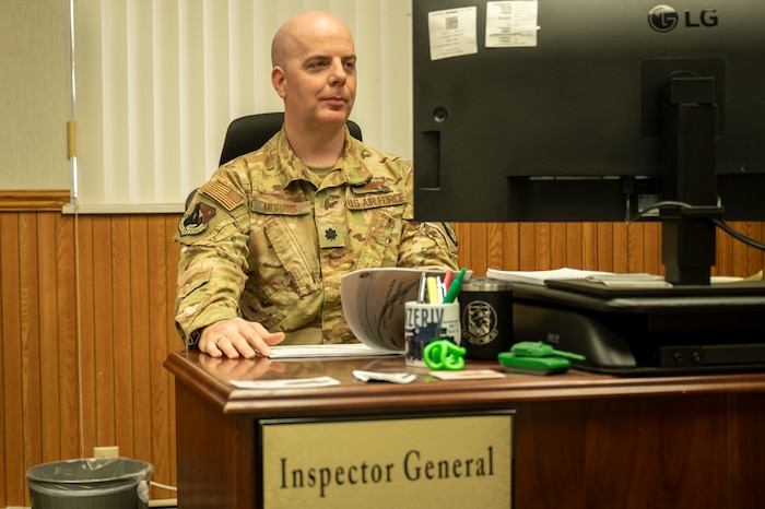 Lt. Col. Timothy Morris, 412th Test Wing inspector general, reviews Air Force instructions during the Unit Effectiveness Inspection at Edwards Air Force Base, California, April 15. The inspection evaluates the wing's mission readiness and compliance with AFIs and associated documents. (Photo by Laisa Leao)