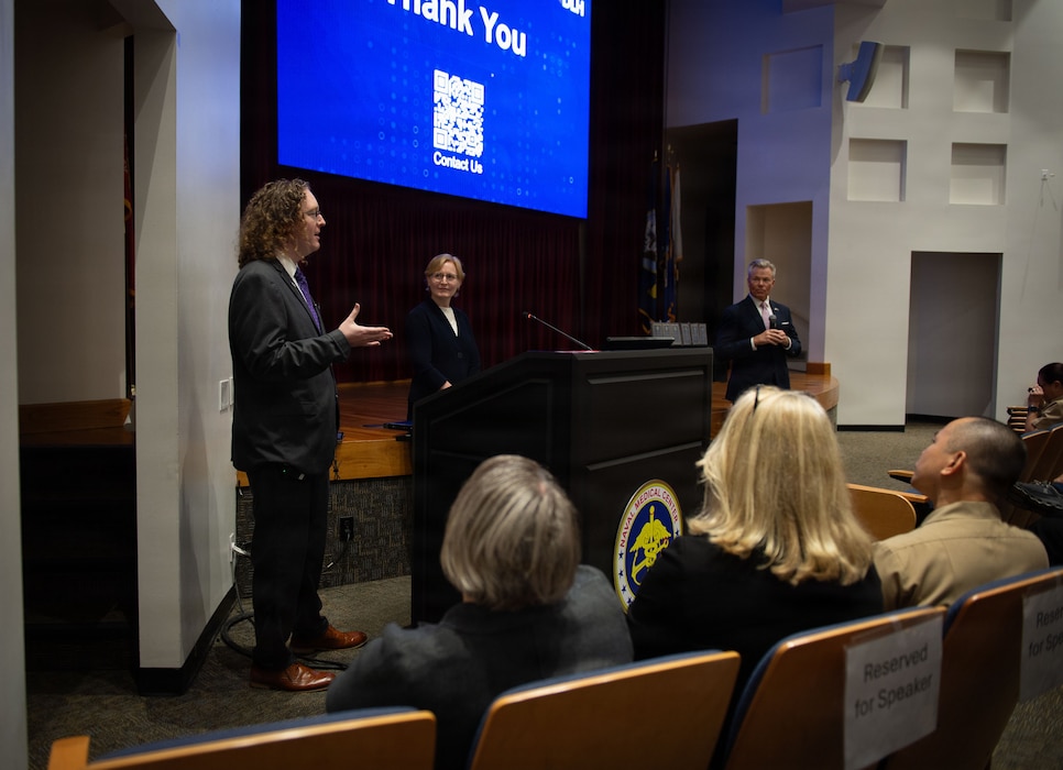 Dr. Nathaniel McNeil, left, Data Engineer and Research Scientist for DLH, Dr. Vicki Hart, Director of Epidemiology & Biostatistics and Strategic Account Executive for Science, Research and Development for DLH, and John Lamberton, Healthcare Practice Leader for DLH and retired U.S. Navy captain, serve as keynote speakers during the41st Academic Research Competition and Innovation Day at Naval Medical Center San Diego, April 10. NMCSD employs more than 5,500 active-duty military personnel, civilians, and contractors in Southern California to deliver exceptional care afloat and ashore. (U.S. Navy photo by Hospital Corpsman 2nd Class Brittany Omana-Mendoza)