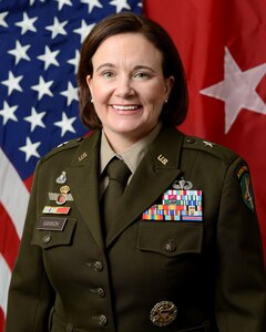 Maj. Gen. Susan M. Gannon poses for her command photo in her AGSU uniform in front of the US flag and the 1-star general flag. Brig. Gen. Gannon is the commander of the 352nd Civil Affairs Command.