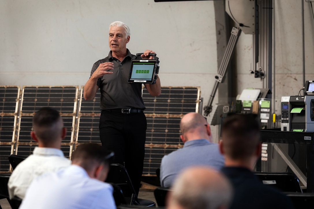 Paul Mattingly, a senior consultant with CGI Federal, explains the Marine Corps Platform Integration Center systems used to track equipment from ship to shore April 15 at Marine Corps Support Facility Blount Island, Florida. Dozens of senior leaders from 2nd Marine Logistics Group participated in a conference hosted by Marine Corps Logistics Command, focused on strengthening a shared understanding of mission, structure, capabilities and innovation efforts, while building relationships to enhance warfighter support. (U.S. Marine Corps photo by Dustin Senger)