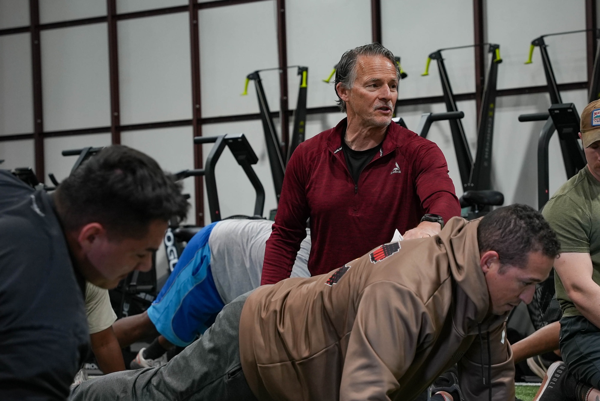 Trent Greener, an Integrated Resilience Optimization Network (IRON) coach, delivers feedback during a physical training session for the new Steadfast Fitness Ambassador Program at Cannon Air Force Base, New Mexico, April 9, 2026. The program selected Air Commandos to serve as force multipliers, extending Air Force Special Operations Command's human performance advantage. (U.S. Air Force photo by Airman Reagan Stout)