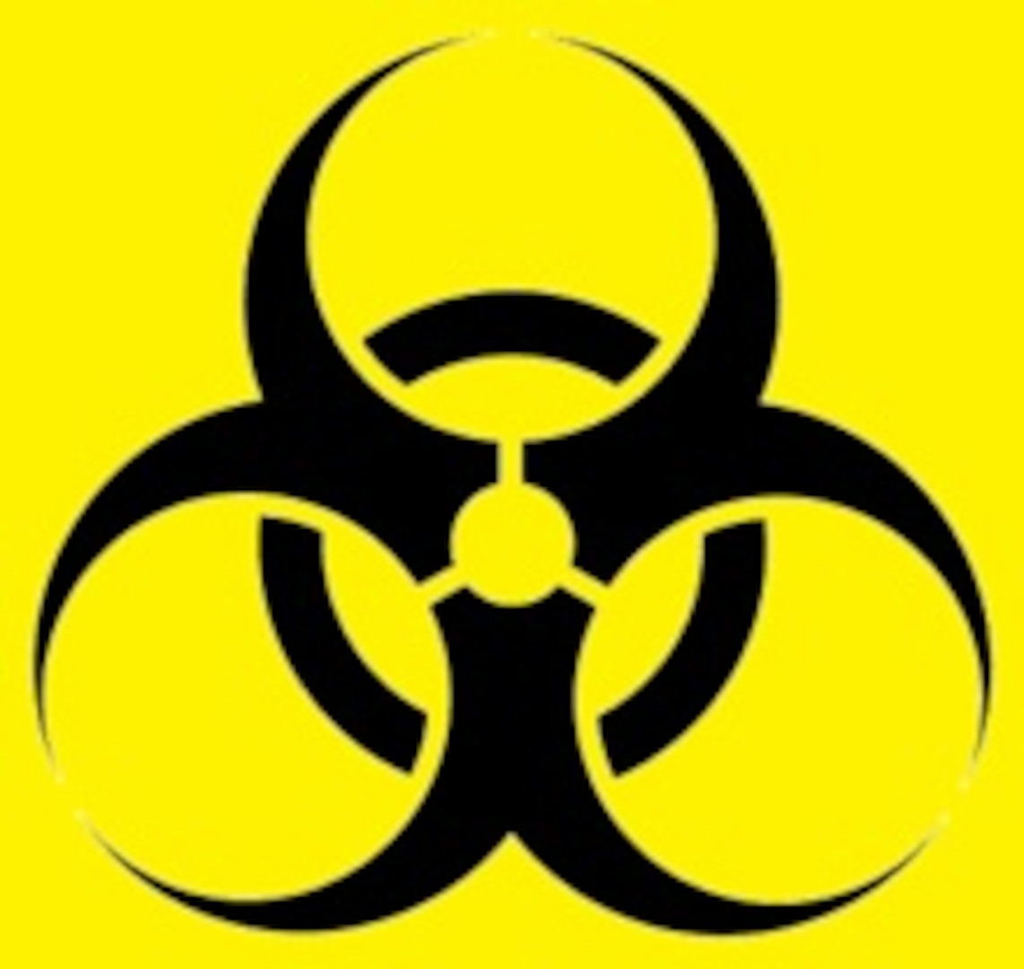 A black biohazard symbol in front of a yellow background.