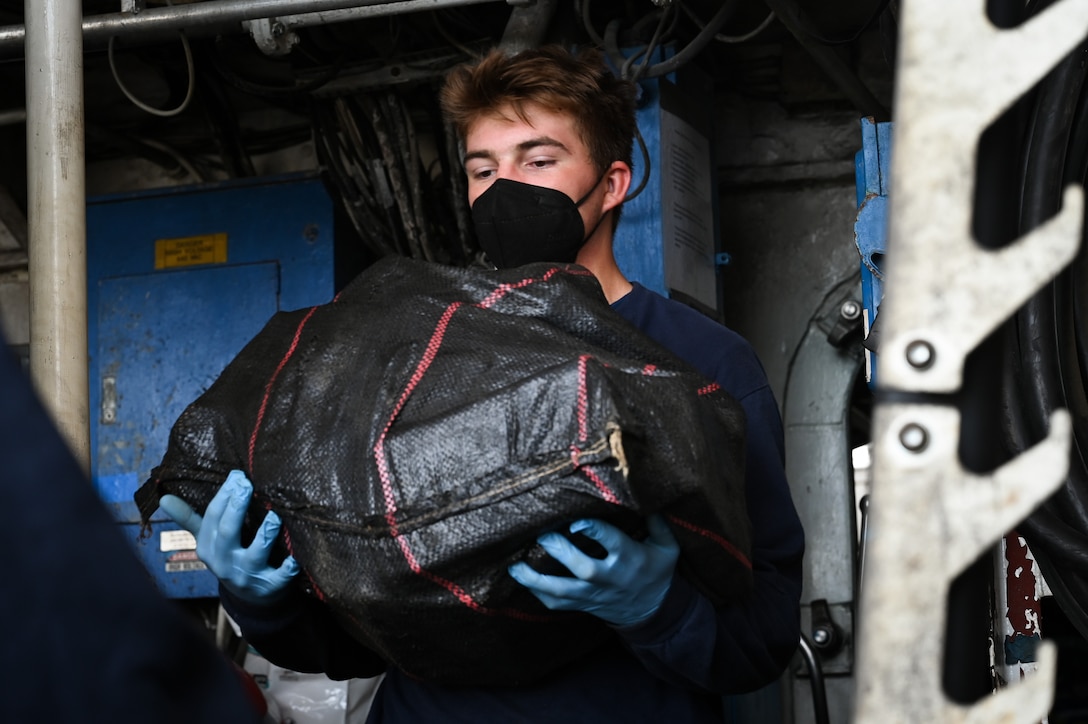 A Coast Guard Cutter Tampa (WMEC 902) crewmember offloads interdicted narcotics at Coast Guard Base Miami Beach, Florida, April 16, 2026. The offload resulted in more than 3,825 pounds of cocaine worth more than $28.7 million due to two interdictions in international waters of the Eastern Pacific Ocean (U.S. Coast Guard photo by Petty Officer 3rd Class Reese Hindmarsh)