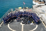 Coast Guard Cutter Tampa’s (WMEC 902) crew poses for a group photo during a drug offload at U.S. Coast Guard Base Miami Beach, Florida, April 16, 2026. Tampa’s crew offloaded nearly $28.7 million in illicit narcotics interdicted in international waters of the Eastern Pacific Ocean. (U.S. Coast Guard photo by Petty Officer 3rd Class Reese Hindmarsh)