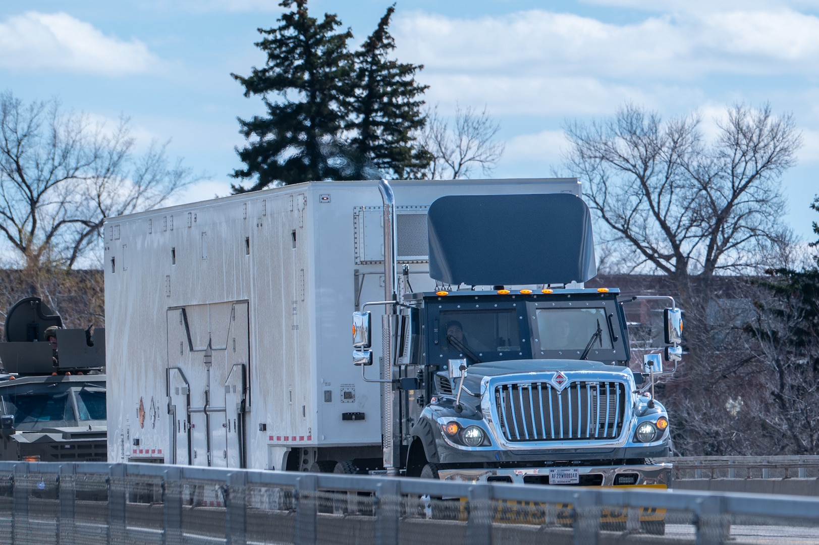A Payload Transporter Replacement drives over a bridge.