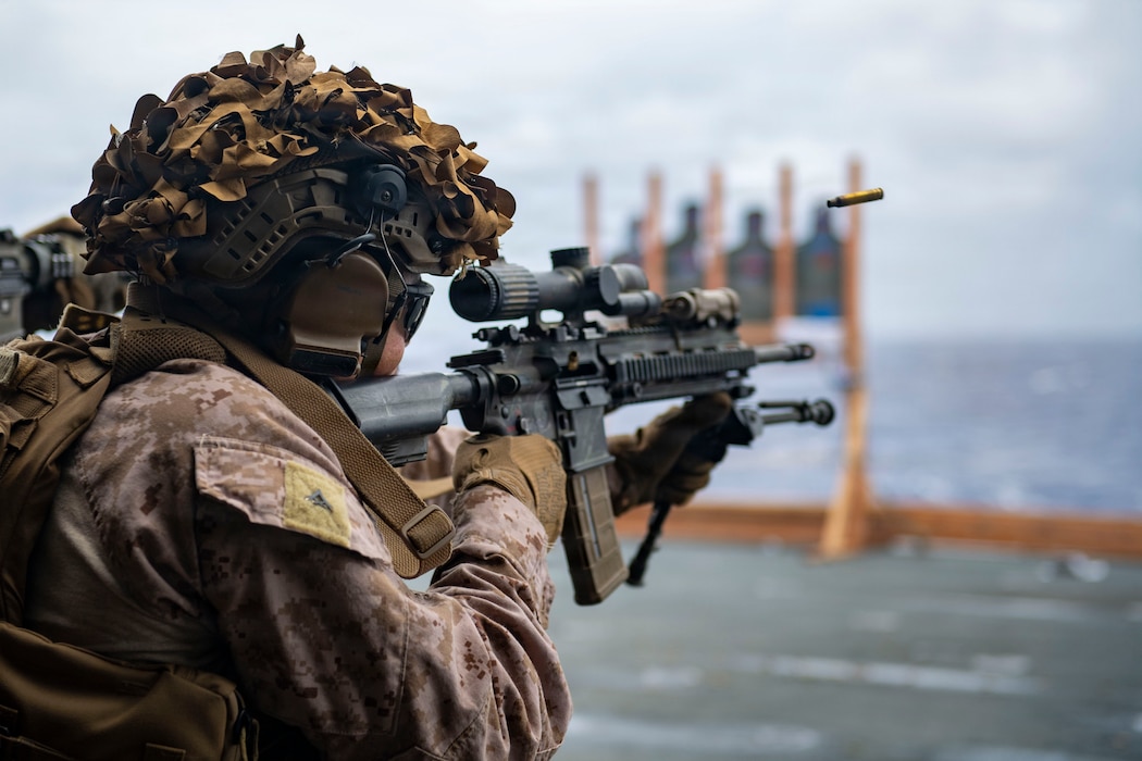 U.S. Marine Corps Lance Cpl. Jose Rodriguez-Barron, assigned to Battalion Landing Team 3/5, 11th Marine Expeditionary Unit, fires an M4 carbine during marksmanship training in the hangar bay of Wasp-class amphibious assault ship USS Boxer (LHD 4), April 13, 2026.