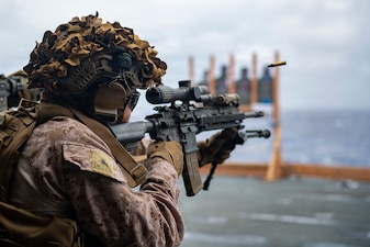 U.S. Marine Corps Lance Cpl. Jose Rodriguez-Barron, assigned to Battalion Landing Team 3/5, 11th Marine Expeditionary Unit, fires an M4 carbine during marksmanship training in the hangar bay of Wasp-class amphibious assault ship USS Boxer (LHD 4), April 13, 2026.
