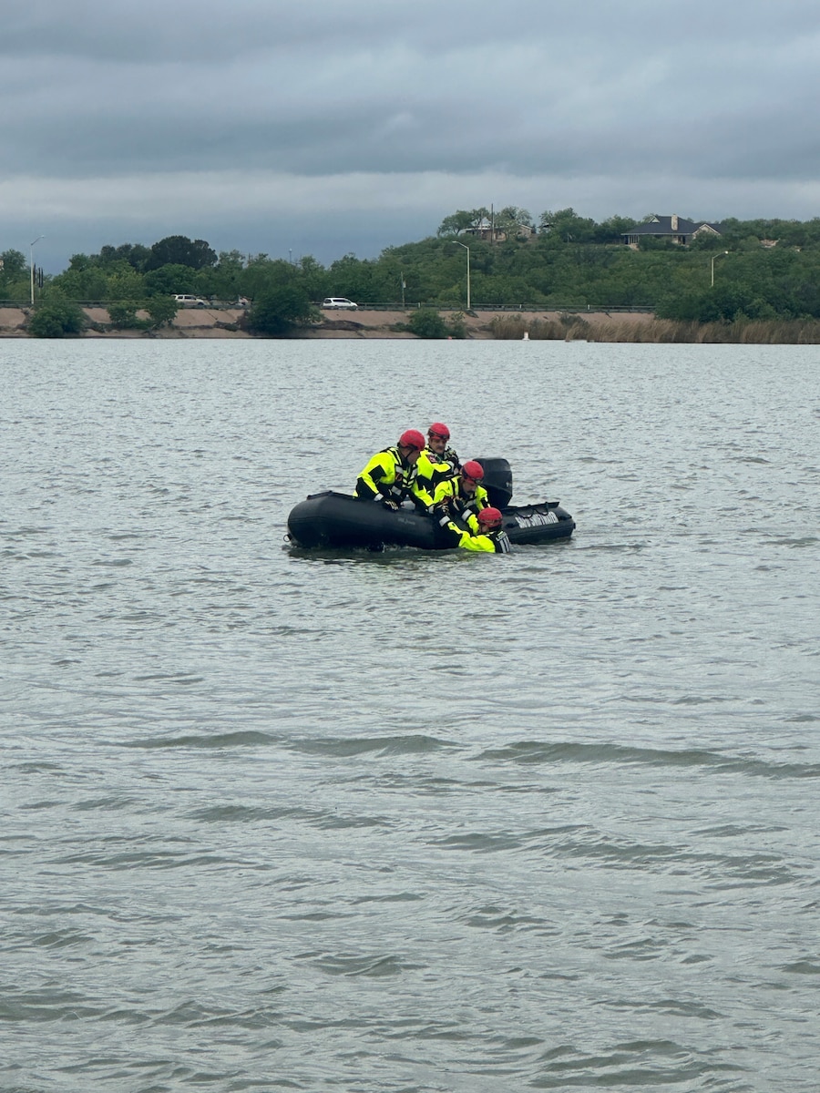 Members of a swift water rescue team conduct water operations during a joint emergency response exercise with the City of San Angelo Mathis Field, at the San Angelo Regional Airport, San Angelo, Texas, April 15, 2026. , April 15, 2026. The exercise included multiple response environments to enhance overall readiness. (Courtesy photo)