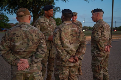 U.S. Air Force Maj. Gen. Roy W. Collins, Air Education Training Command deputy commander, meets with 17th Security Forces Squadron leadership outside the Western Winds Dining Facility at Goodfellow Air Force Base, Texas, April 10, 2026. Collins started his tour with a Defenders’ Breakfast to connect with the members of his first career field. (U.S. Air Force photo by Senior Airman Brian Lummus)