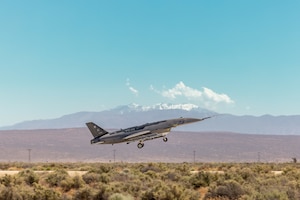 A YFQ-44A takes off from the runway at Edwards Air Force Base, Calif., during a Collaborative Combat Aircraft exercise. The Experimental Operations Unit’s exercise united the test authorities of Air Force Materiel Command and the operational authorities of Air Combat Command to fast-track hands-on experimentation at an early stage of development. (U.S. Air Force photo by Ariana Ortega)