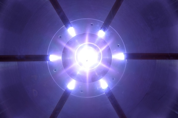 Six plasma guns shoot Teflon plasma towards the central axis of a plasma-filled rod pinch diode. This pulsed power device, developed by the U.S. Naval Research Laboratory, produces an intense, fast x-ray pulse, enabling new capabilities for radiography of military materials and components. (U.S. Navy photo)