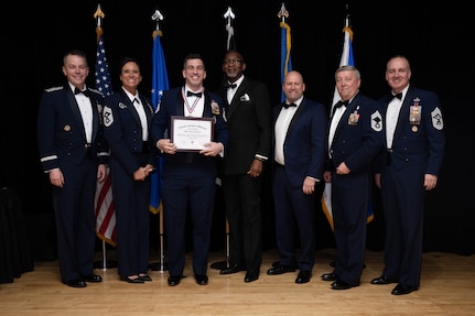 The U.S. Air Force Recruiting Service’s Robert “Bob” Gaylor Blue Suit Scholarship from Columbia Southern University is presented during the Operation Blue Suit Award Banquet at the Parr Club on Joint Base San Antonio-Randolph, Texas, April 2, 2026.Master Sgt. Justin Dougherty was awarded the scholarship based on an essay requirement in reference to Chief Master Sgt. of the Air Force David Wolfe’s formula for building high performing teams. Dougherty was able to articulate in his essay how he embodies the formula into his leadership and guidance of his team.