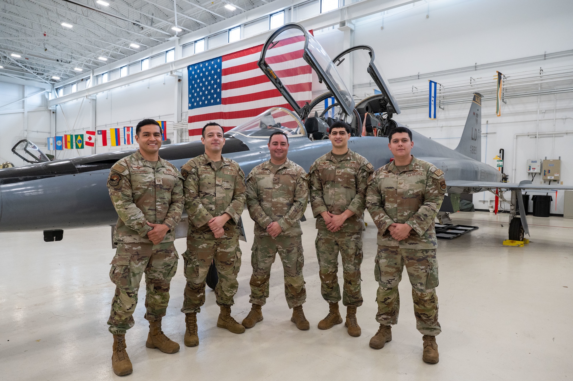 Pictured from left: Tech. Sgt. Erik Garduno, Tech. Sgt. Jose Fernandez, Master Sgt. Eddie Santana, Staff Sgt. Justen Garrido and Staff Sgt. Armando Rios of the 318th Training Squadron stand in the hangar at the IAAFA Airfield Training Complex, Feb. 17, 2026, at Joint Base San Antonio-Lackland, Texas. The team was hand selected as subject matter experts to conduct an advanced aircraft systems maintenance course as part of a mobile training team in Thailand. It was the first time IAAFA provided training to the Royal Thai Air Force in Thailand. (U.S. Air Force photo by Vanessa R. Adame)