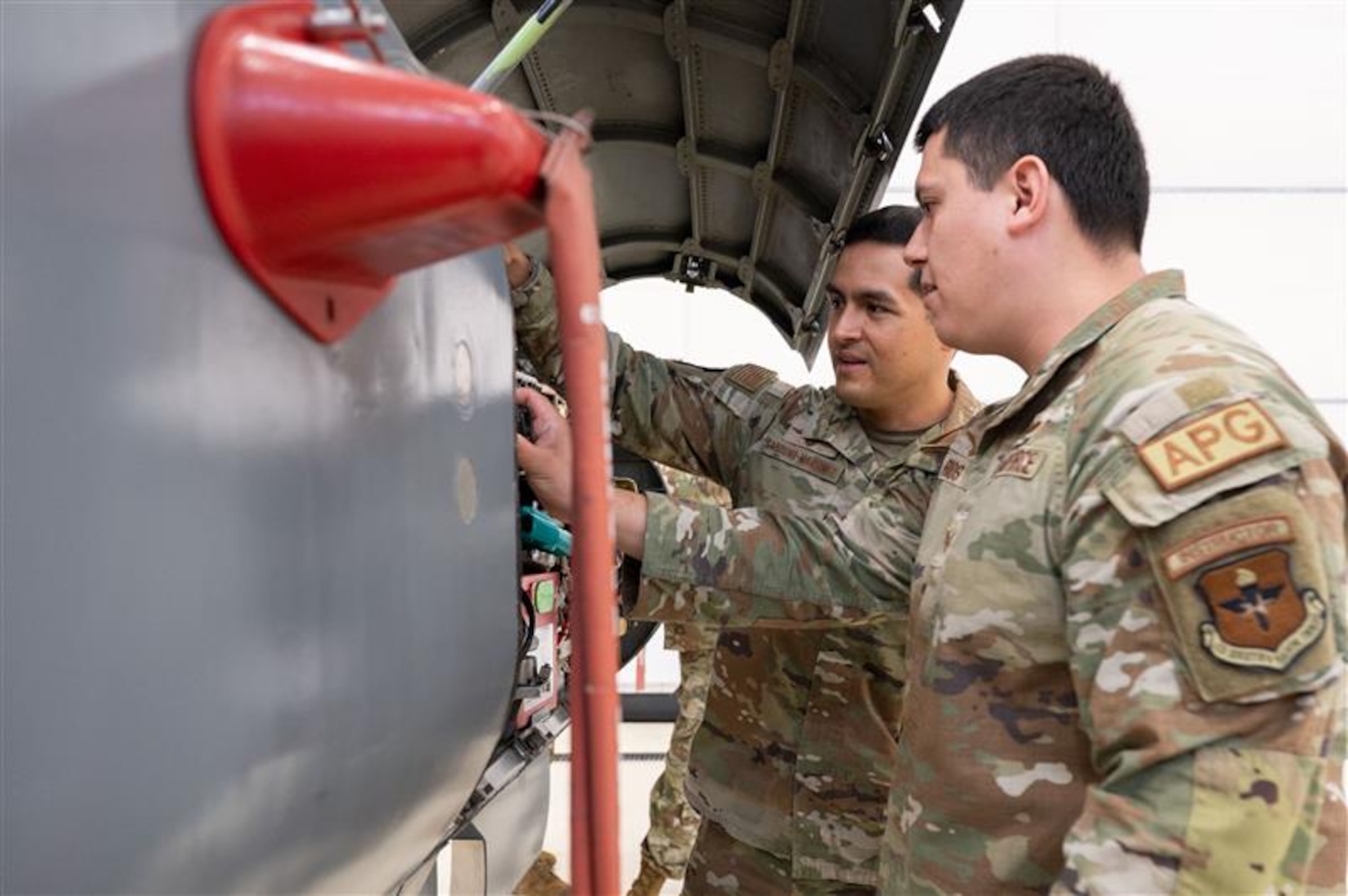 Staff Sgt. Armando Rios examines the equipment bay on the F-5 at the Inter-American Air Forces Academy, Feb. 17, 2026, at Joint Base San Antonio-Lackland, Texas. Rios served one of five instructors for an F-5 advanced aircraft systems maintenance course in Thailand. It was IAAFA’s first time training the Royal Thai Air Force. IAAFA is aligned under the 37th Training Wing and provides instruction in professional military education and leadership, aircrew training and technical courses in Spanish. (U.S. Air Force photo by Vanessa R. Adame)