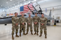 Pictured from left: Tech. Sgt. Erik Garduno, Tech. Sgt. Jose Fernandez, Master Sgt. Eddie Santana, Staff Sgt. Justen Garrido and Staff Sgt. Armando Rios of the 318th Training Squadron stand in the hangar at the IAAFA Airfield Training Complex, Feb. 17, 2026, at Joint Base San Antonio-Lackland, Texas. The team was hand selected as subject matter experts to conduct an advanced aircraft systems maintenance course as part of a mobile training team in Thailand. It was the first time IAAFA provided training to the Royal Thai Air Force in Thailand. (U.S. Air Force photo by Vanessa R. Adame)