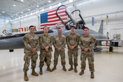 Pictured from left: Tech. Sgt. Erik Garduno, Tech. Sgt. Jose Fernandez, Master Sgt. Eddie Santana, Staff Sgt. Justen Garrido and Staff Sgt. Armando Rios of the 318th Training Squadron stand in the hangar at the IAAFA Airfield Training Complex, Feb. 17, 2026, at Joint Base San Antonio-Lackland, Texas. The team was hand selected as subject matter experts to conduct an advanced aircraft systems maintenance course as part of a mobile training team in Thailand. It was the first time IAAFA provided training to the Royal Thai Air Force in Thailand. (U.S. Air Force photo by Vanessa R. Adame)