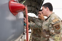 Staff Sgt. Armando Rios examines the equipment bay on the F-5 at the Inter-American Air Forces Academy, Feb. 17, 2026, at Joint Base San Antonio-Lackland, Texas. Rios served one of five instructors for an F-5 advanced aircraft systems maintenance course in Thailand. It was IAAFA’s first time training the Royal Thai Air Force. IAAFA is aligned under the 37th Training Wing and provides instruction in professional military education and leadership, aircrew training and technical courses in Spanish. (U.S. Air Force photo by Vanessa R. Adame)
