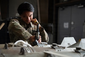 U.S. Air Force Airman Alexander Sou, 51st Munitions Squadron conventional maintenance technician, initiates built in testing of the tail kit at Osan Air Base, Republic of Korea, April 14, 2026. Sou’s daily responsibilities include testing and maintaining munitions to utilize on F-16 Fighting Falcons. (U.S. Air Force photo by Airman 1st Class Megan Cusmano)