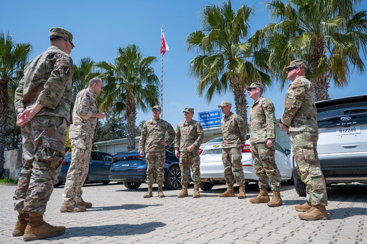 A group of service members standing in a circle