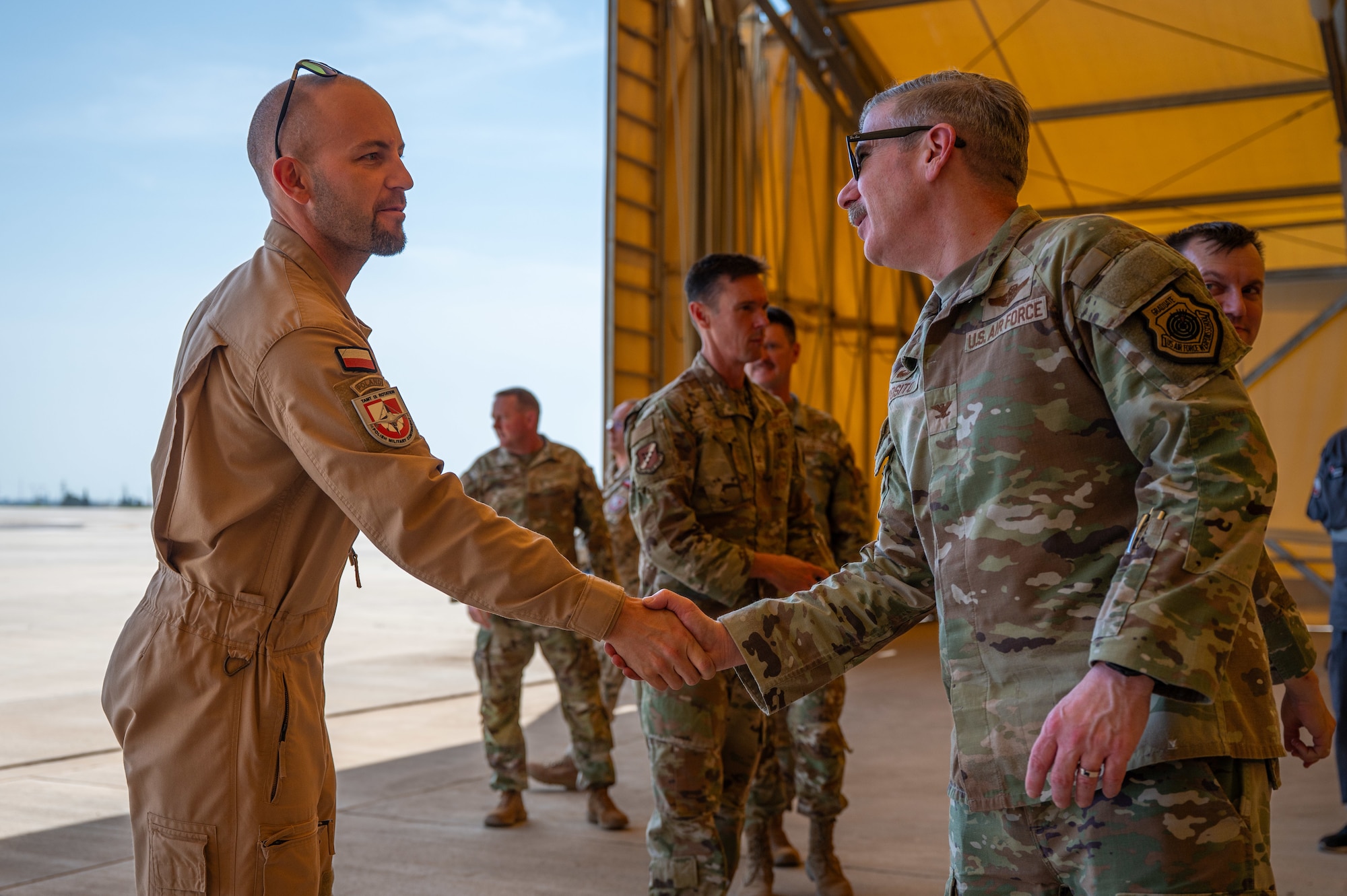 Two military members shaking hands