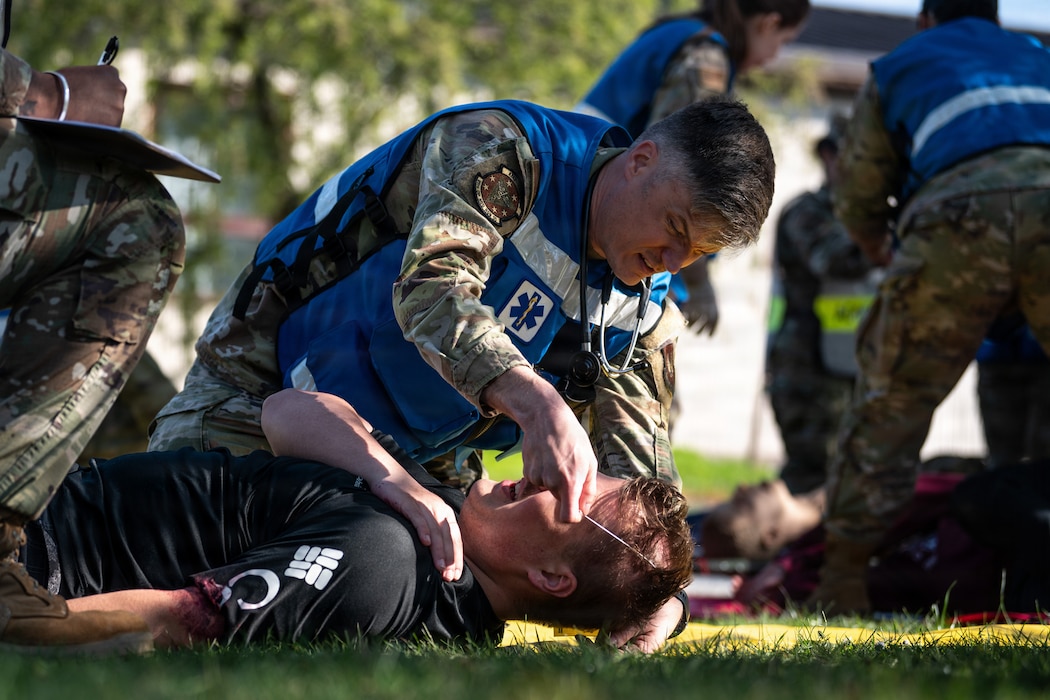U.S. Air Force Capt. John Harris, 86th Operational Medical Readiness Squadron flight surgeon, performs triage on a simulated patient during a mass casualty exercise at Ramstein Air Base, Germany, April 15, 2026.