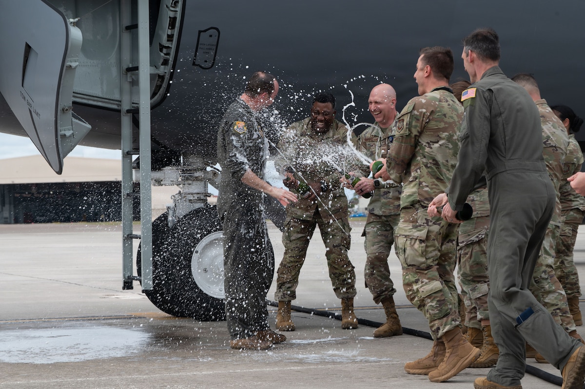 Col. James Long II, 6th Air Refueling Wing deputy commander, is sprayed with champagne following his fini-flight at MacDill Air Force Base, Fla., April 7, 2026. Long completed more than 4,400 flight hours across four aircraft during his career. (U.S. Air Force photo by Airman Angelica Richardson)