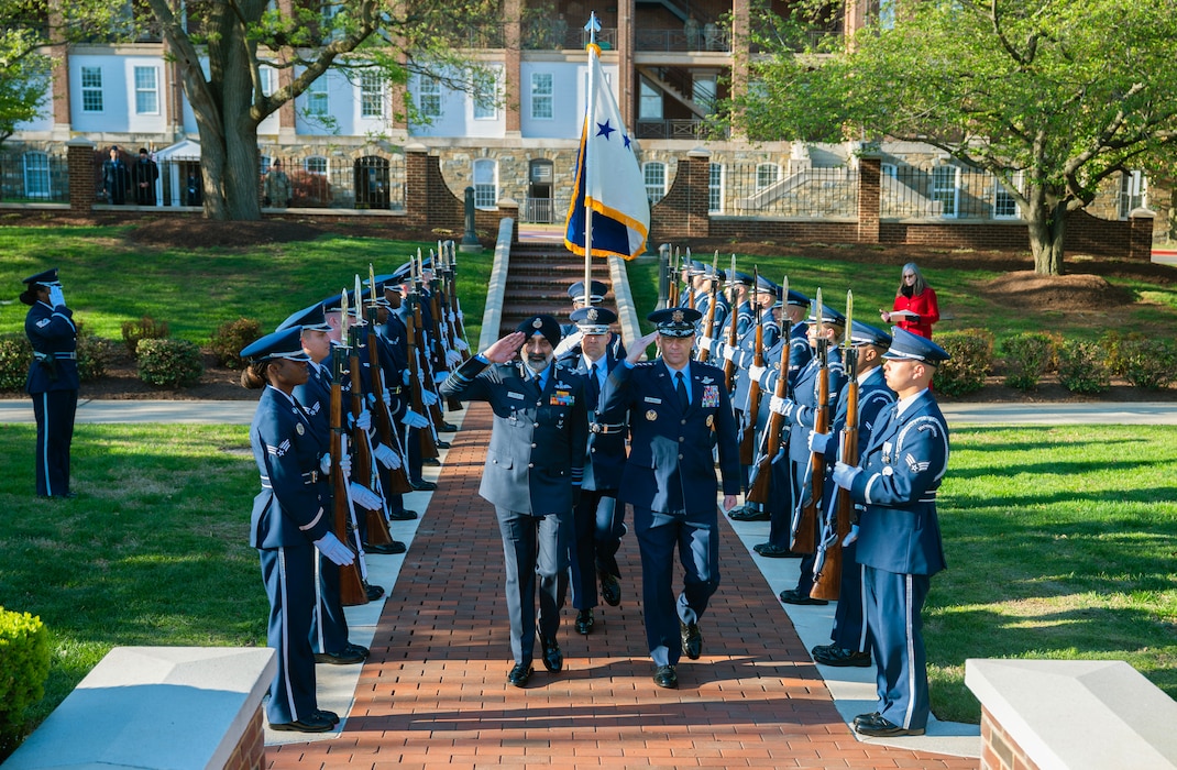 Leaders saluting honor guard