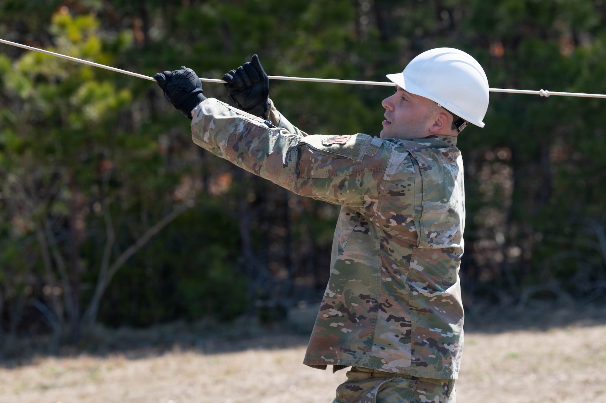 An airman builds a tent.