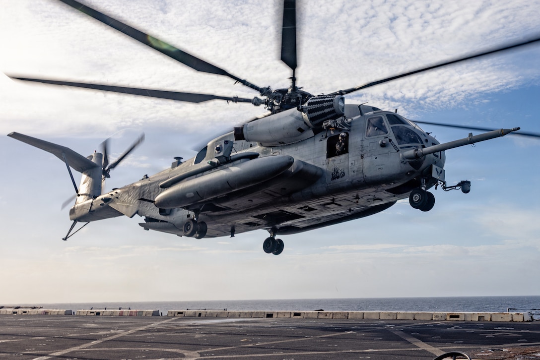 A U.S. Marine Corps CH-53E Super Stallion helicopter with Marine Medium Tiltrotor Squadron (VMM) 263 (Reinforced), 22nd Marine Expeditionary Unit (Special Operations Capable), takes off during flight operations aboard San Antonio-class amphibious transport dock USS San Antonio (LPD 17) while underway in the Caribbean Sea, April 7, 2026. U.S. military forces are deployed to the Caribbean in support of the U.S. Southern Command mission, Department of War-directed operations, and the president’s priorities to disrupt illicit drug trafficking and protect the homeland. (U.S. Marine Corps photo)