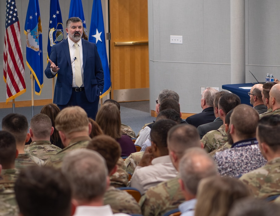 Image of a man addressing an audience.
