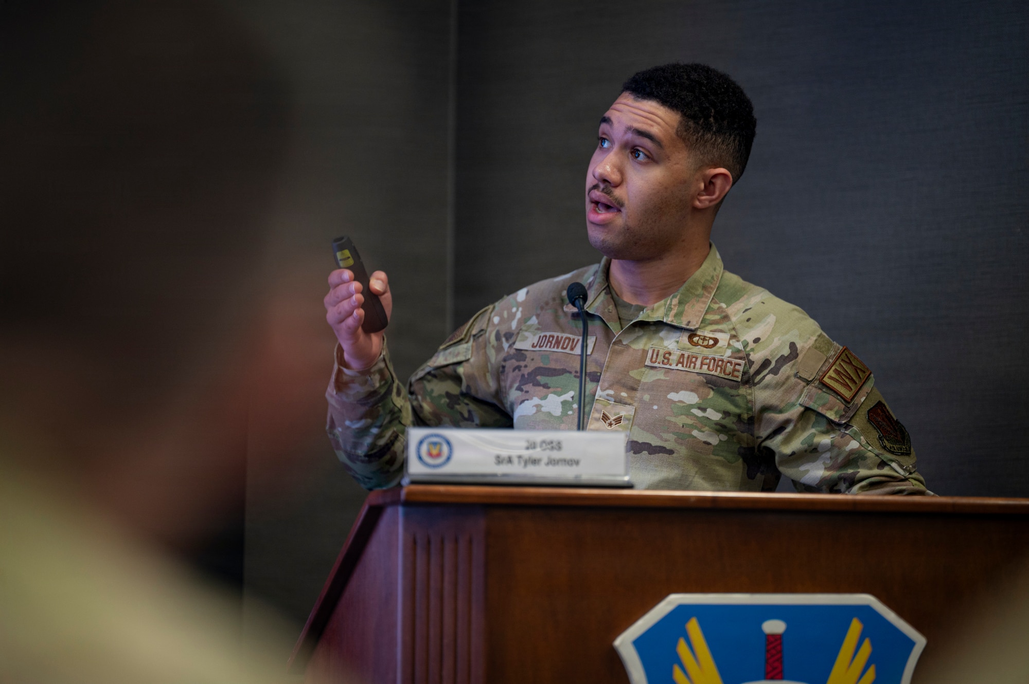 Senior Amn. Tyler Jornov, 20th OSS weather specialist, briefs top Air Combat Command leaders on his newly developed AI driven weather data analysis tool, Joint Base Langley-Eustis, Virginia, March 24, 2026. The tool was developed as a part of a growing initiative facilitated by the ACC Operations Directorate’s newly established AI division. (U.S. Air Force photo by Staff Sgt. Michael Bowman)