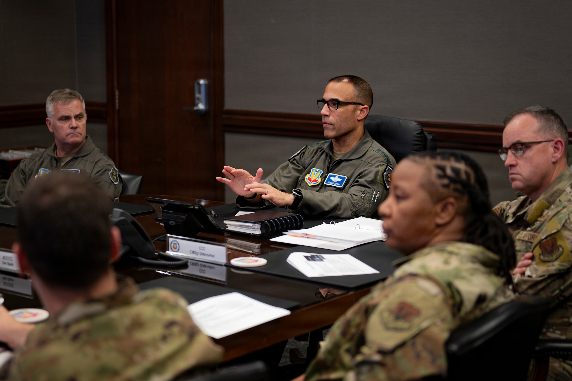 U.S. Air Force Gen. Adrian Spain, commander of Air Combat Command, speaks with his staff during a brief, Joint Base Langley-Eustis, Virginia, March 24, 2026. ACC has activated a first-of-its-kind AI division under the operations directorate, focused on operationalizing cutting-edge machine learning technology across the combat air forces. (U.S. Air Force photo by Staff Sgt. Michael Bowman)