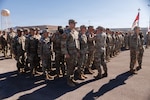 U.S. Army Soldiers attached to the 1st Battalion, 221st Cavalry, B Company, receive their blue cord during a 