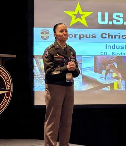 Maj. Gen. Lori Robinson, commander of the U.S. Army Aviation and Missile Command, delivers opening remarks at an Industry Day session during the AAAA Warfighting Summit in Nashville, Tennessee, emphasizing collaboration between the Army and industry partners.
