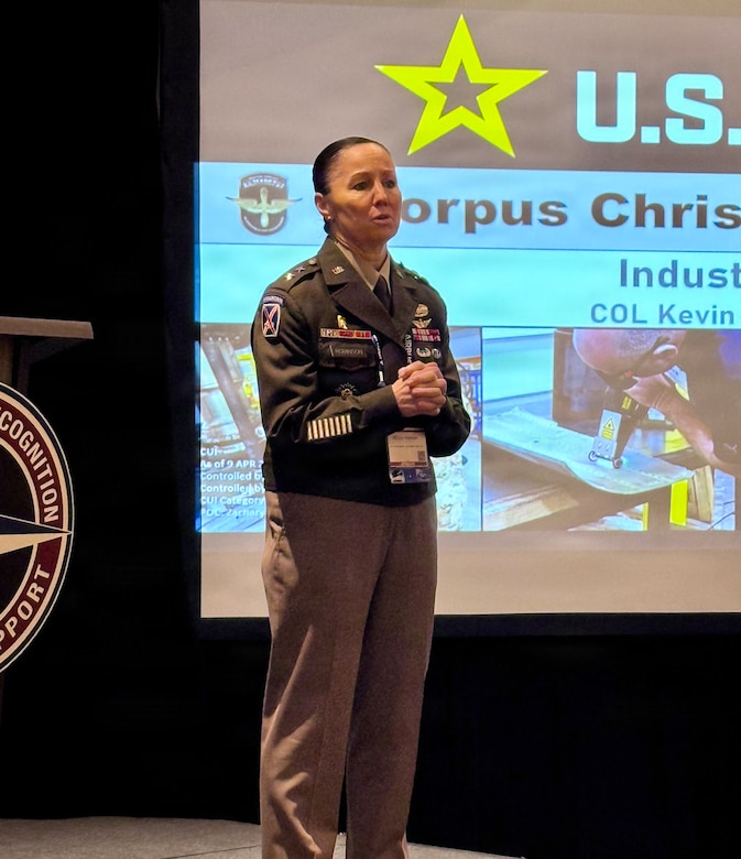 Maj. Gen. Lori Robinson, commander of the U.S. Army Aviation and Missile Command, delivers opening remarks at an Industry Day session during the AAAA Warfighting Summit in Nashville, Tennessee, emphasizing collaboration between the Army and industry partners.