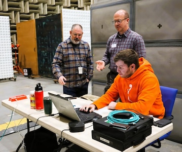 From left: Adam Wechsler, data scientist for the NSWCPD Machinery Research & Silencing Division; Nate Brown, mechanical research engineer at Luna Labs; and Colin Dingley, NSWCPD machine learning engineer, review vibration data. The team is testing an embedded Condition-Based Monitoring (eCBM) system designed to predict mechanical failures before they occur. (U.S. Navy photo by Sgt. Najee Tate-Milton)