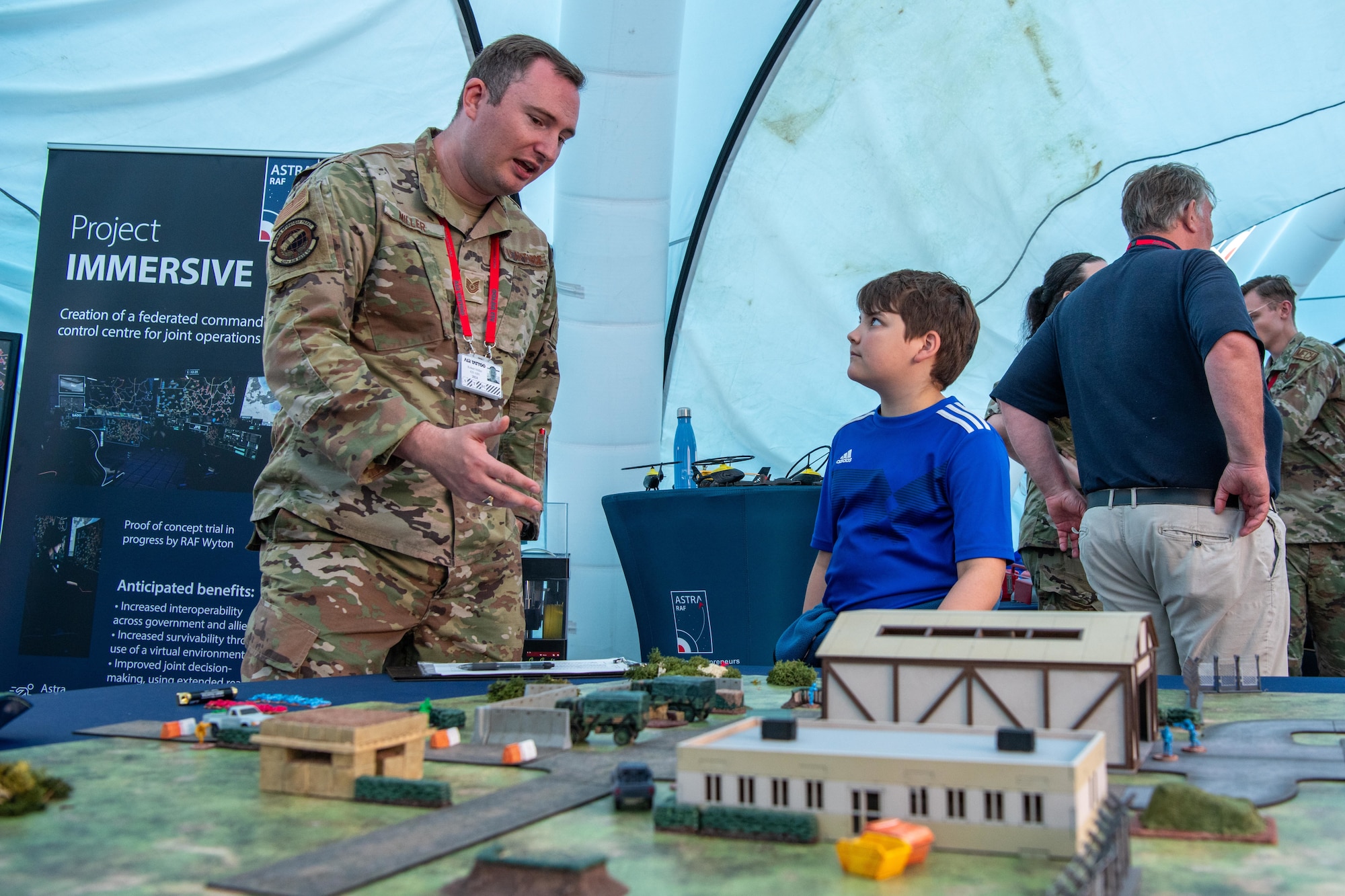 U.S. Air Force Tech. Sgt. Robert Miller, 420th Air Base Squadron air traffic control watch supervisor, explains "Integrated Defense Tabletop Training" during the Royal International Air Tattoo (RIAT)