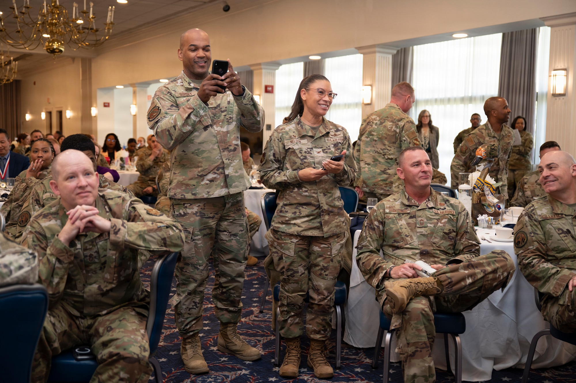 Airmen with the 11th Wing show support for the award winners at the Air Force District of Washington annual awards ceremony at Joint Base Anacostia-Bolling, Washington, D.C., April 9, 2026. The ceremony highlighted members across AFDW for their mission accomplishments throughout the year. (U.S. Air Force photo by Airman 1st Class Arlene Carrara)